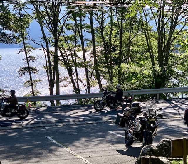 Japan motorcycle tours ninjatours tokyo kawamata parking area with trees