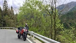 japan motorcycle tours ninjatours mt fuji kiso tree lined road with mountain view