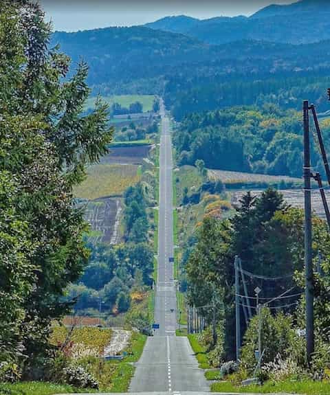 Japan motorcycle rentals ninjatours hokkaido shakotan kitami rollercoaster road seen from a distance