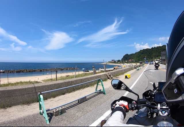 Ninjatours Japan motorcycle tour Yunohama parking area with motorcycles and blue skies with clouds