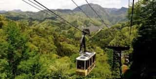 Japan motorcycle tour ninjatours ropeway with mountain and treeline view