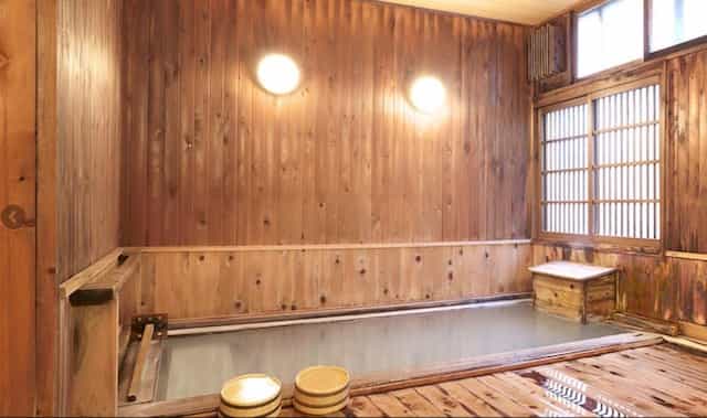 Japan motorcycle tour ninjatours ryokan entrance traditional japanese inn onsen hot springs bath