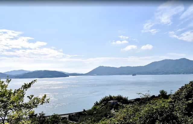 Japan motorcycle tour ninjatours Shikoku mountains over ocean view