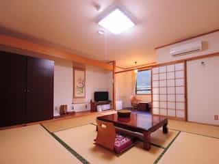 Japan motorcycle tour ninjatours arima onsen kagawa ryokan traditional bedroom