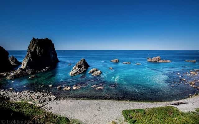 Japan motorcycle tours ninjatours hokkaido hakodate shakotan coastal view of rocks and cape