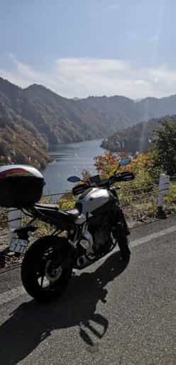 Japan motorcycle tour ninjatours matsunoyama onsen inawashiro parked valley view 