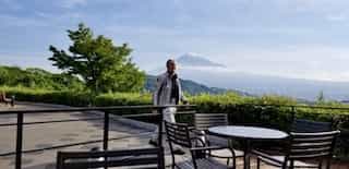 japan motorcycle tours ninjatours nishi izu shorenji lake parking area with mountains and clouds